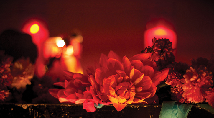 Candles and flowers on a shrine