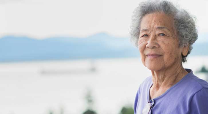 Older person in front of an inlet