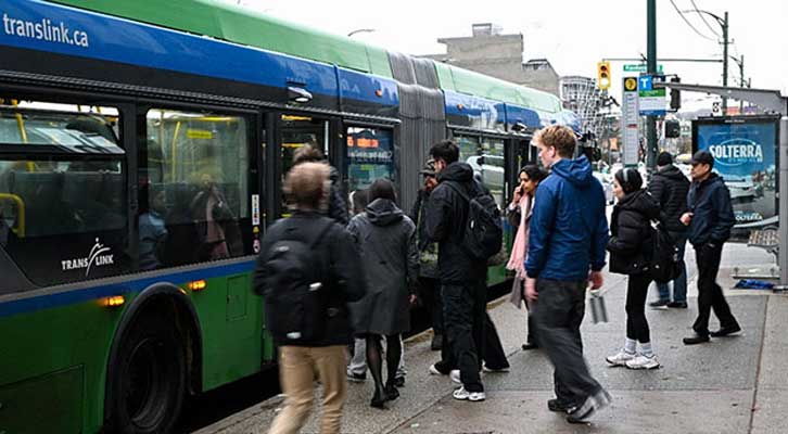 People waiting to get on a bus