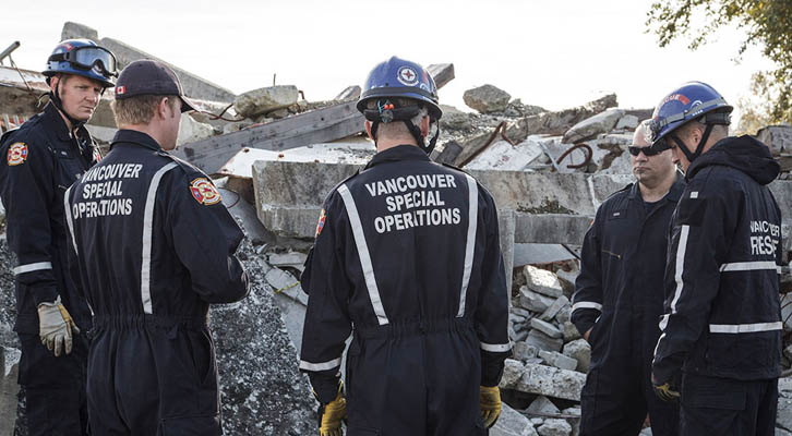 Vancouver Special Operations crew looking at concrete rubble