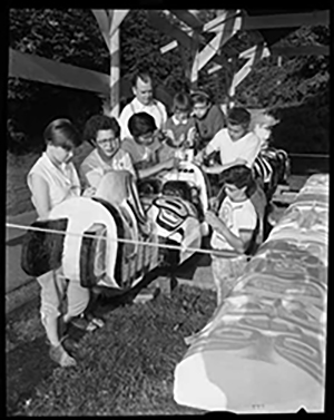 Ellen Neel and her family surrounding the totem pole