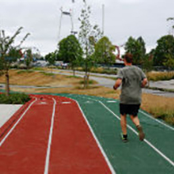 Person running on a track field