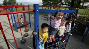 Children playing on playground equipment