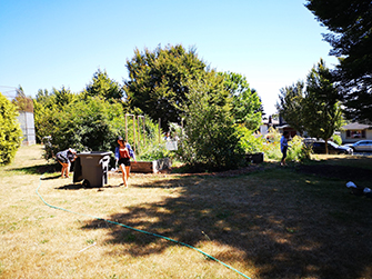 Community members working in raised garden beds at Moberly Community Garden.