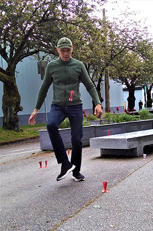 Artist Paul de Guzman plays sipa during a performance of laro na tayo – let's play. Photo by Ash Tanas.