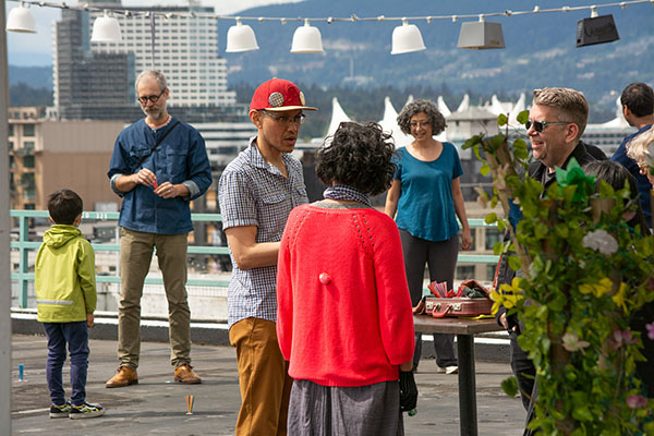 Artist Paul de Guzman engages with participants during a performance of laro na tayo – let's play. Photo by Ash Tanas