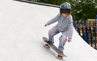 A young skateboarder on a halfpipe