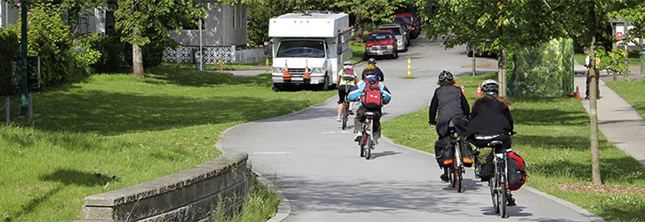 People cycling on the 10th Avenue Corridor through China Creek Park People cycling on the 10th Avenue Corridor through China Creek Park