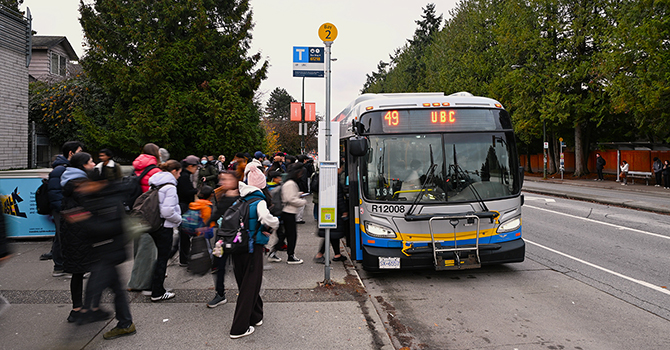 People boarding bus number 49 to UBC