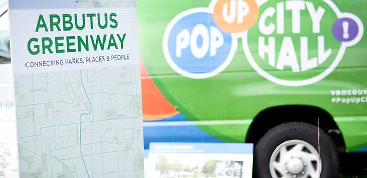 Arbutus Greenway map on board in front of Pop-Up City Hall cube van