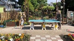 A woman and child playing ping-pong on the Arbutus Greenway