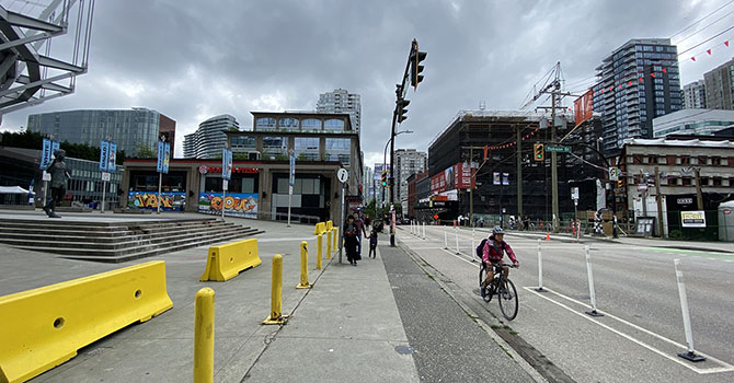 Cyclist riding on protected bike lane on Beatty Street Cyclist riding on protected bike lane on Beatty Street