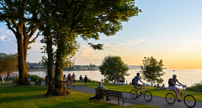 Cyclists biking along a trail