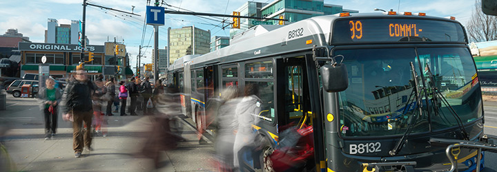 People boarding a B line bus at Broadway and Cambie