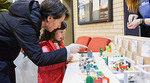 Mother and daughter engaging with City staff using Lego Mother and daughter engaging with City staff using Lego