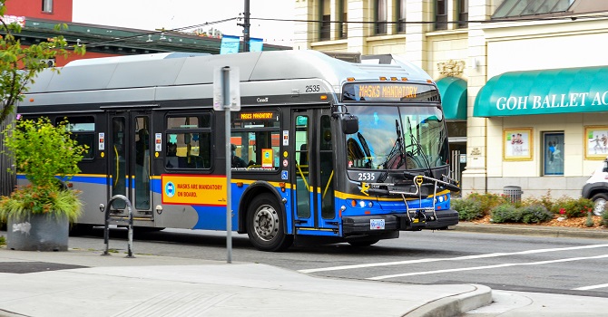 A transit bus stopped at a crosswalk