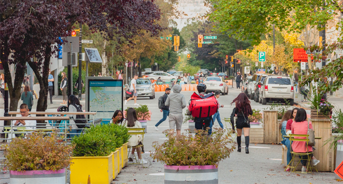 People enjoying an outdoor plaza on Bute Street