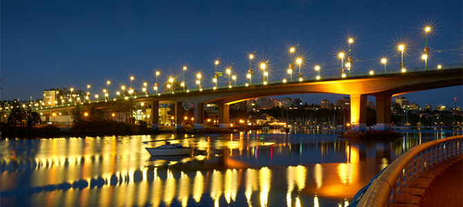 The Cambie Bridge at night with bright street lights