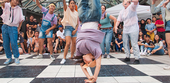 People gathered around people dancing