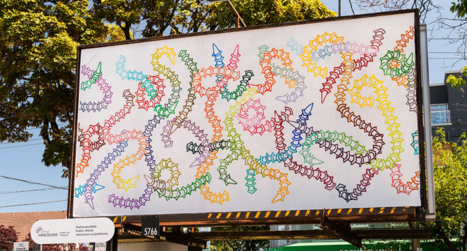 A painting of colourfully stacked traffic cones titled Coneworm Floe by Sunny Nestler featured on a billboard