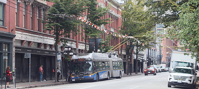 Cordova street with a bus and cars Cordova street with a bus and cars