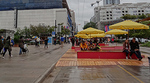 People sitting under umbrellas at Corduroy Road People sitting under umbrellas at Corduroy Road