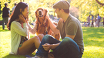 Couple with dog in park