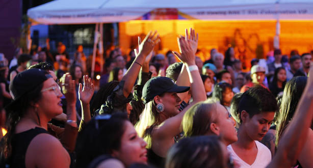 People clapping in a crowd