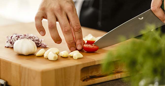 Cutting vegetables on a cutting board