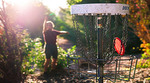 Person playing disc golf