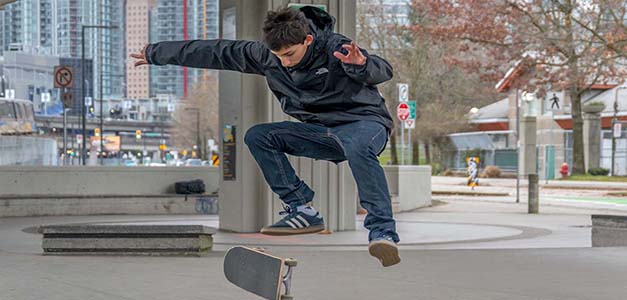 A youth performing a skateboard trick