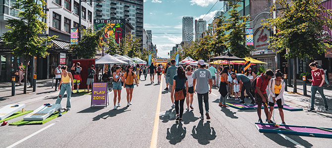 People walking on Granville Street during a festival