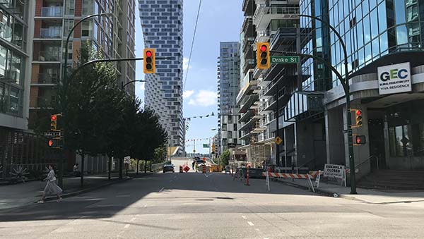 A woman crossing Drake Street. 