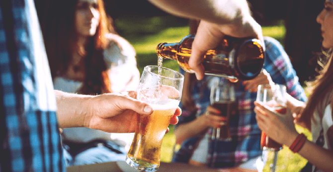 People drinking at a park