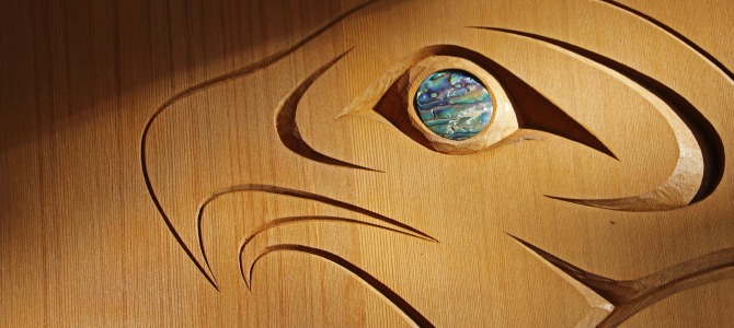 Carved eagle head with abalone shell inlay for the eye Carved eagle head with abalone shell inlay for the eye