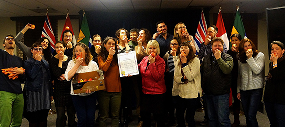 Vancouver Food Policy team holding apples and celebrating a proclamation 