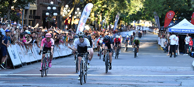 Cyclist ride through the streets of Gastown for the Gastown Grand Prix