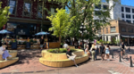 People sitting outside in Gastown on a sunny day