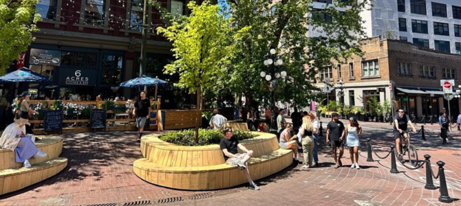 People sitting outside in Gastown on a sunny day People sitting outside in Gastown on a sunny day
