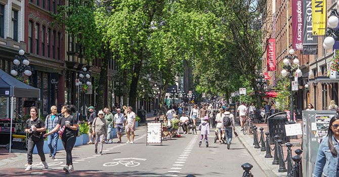 People walking in Gastown in the summer People walking in Gastown in the summer