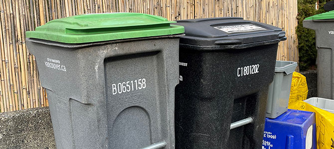 Garbage, green bin, and recycling set out for curbside collection