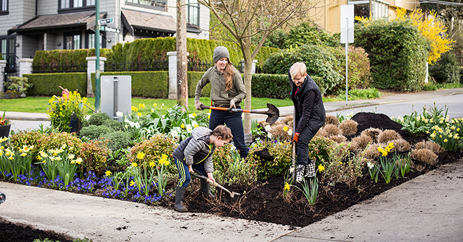 People working in a street garden