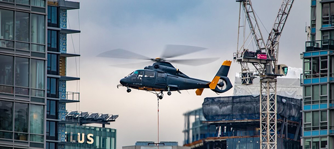 A low-flying helicopter in downtown Vancouver