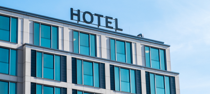 A hotel with a sign saying A hotel with a sign saying
