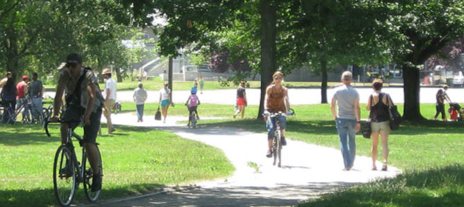 People walking and cycling in John Hendry Park People walking and cycling in John Hendry Park