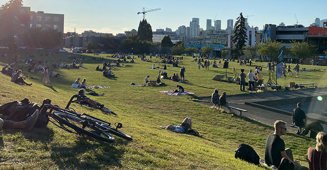 People sitting on the grass at Jonathan Rogers Park