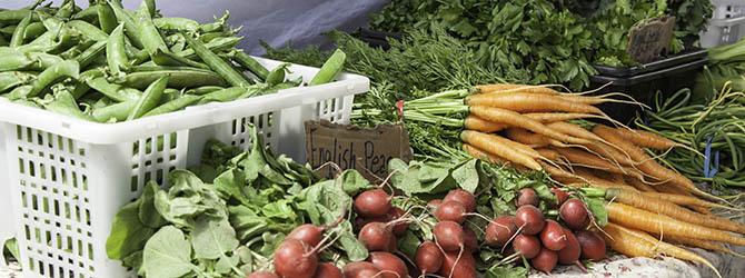 Closeup of produce table at Kitsilano Farmers Market