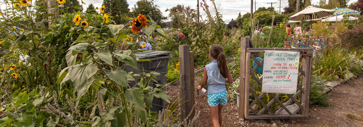 Girl enters community garden in Vancouver, Greenest City