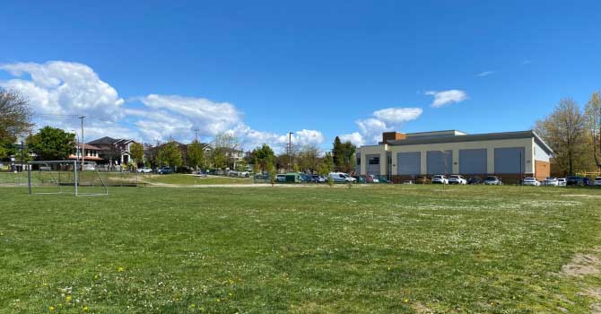 View of Moberly Park's grass field