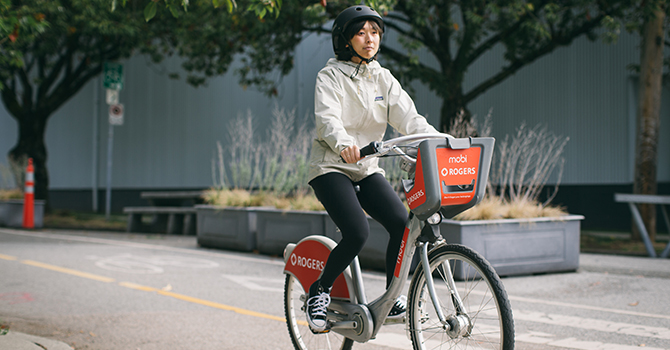 A cyclist riding a Mobi by Rogers bike